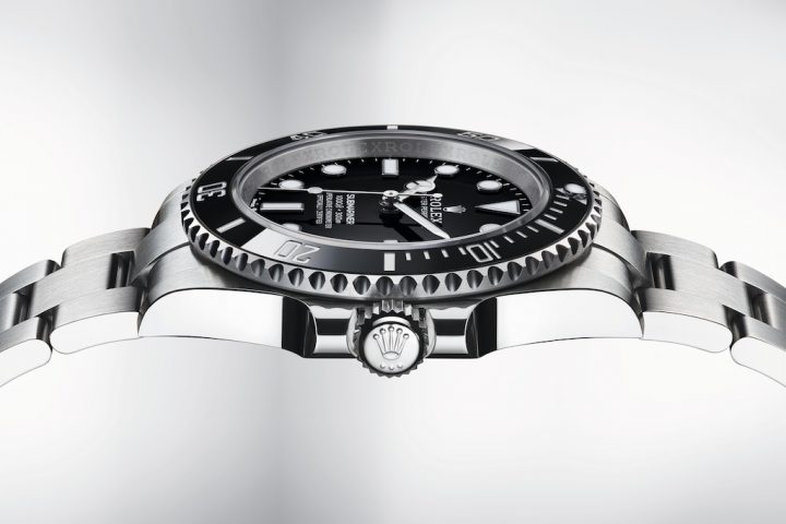 A side profile of the new Rolex Submariner, showing the watch face and the iconic Rolex crown.