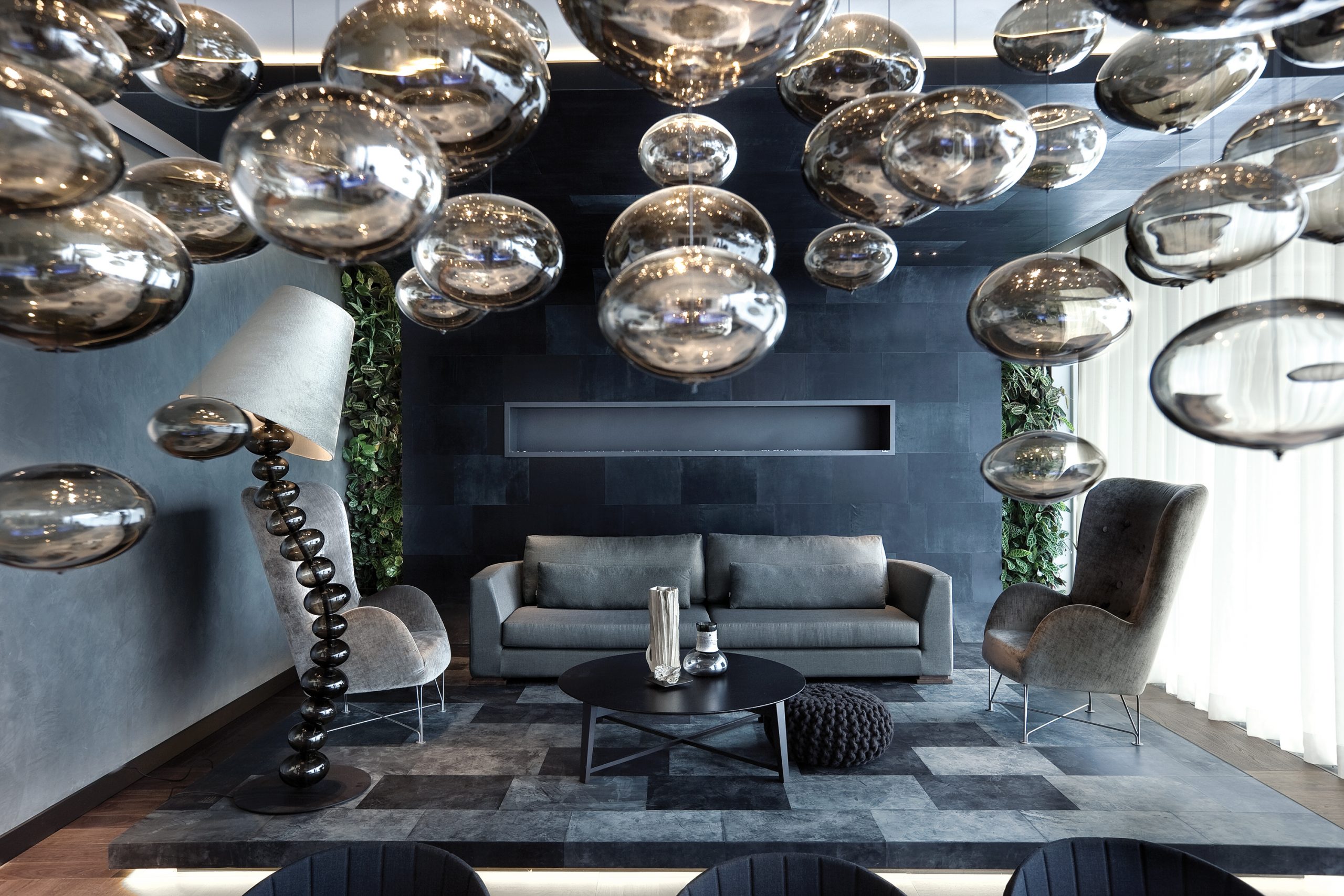 Eco-Chic, according to Robert Kolenik, in the show interior he designed as an apartment at the headquarters of the Dutch lighting specialists, Maretti