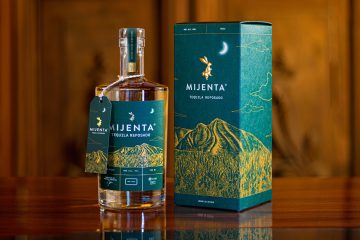 Mijenta Reposado Bottle Giftbox Wooden Background