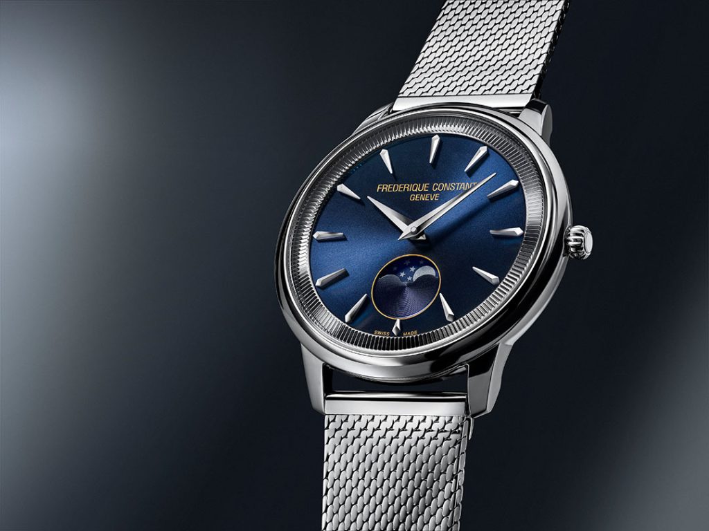 Frederique Constant Classics Moneta Moonphase with a deep blue sunray dial, stainless steel 37 mm case, and Milanese mesh bracelet.